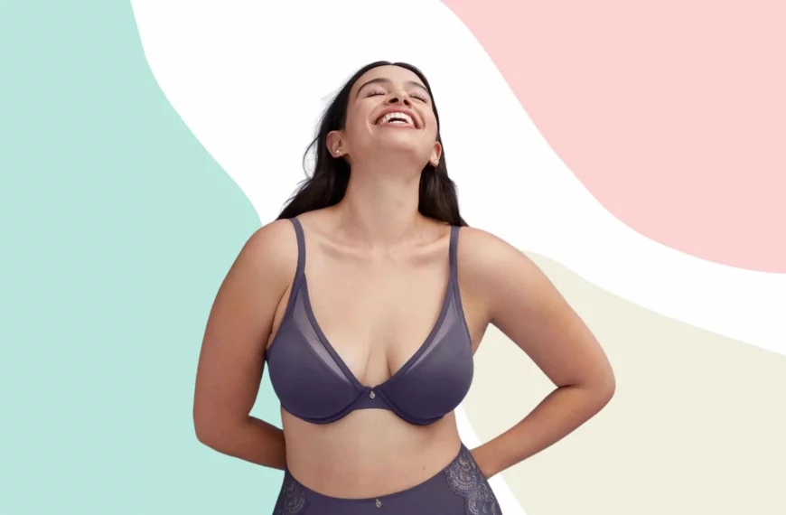 woman looking up and smiling, wearing a gray thirdlove bra