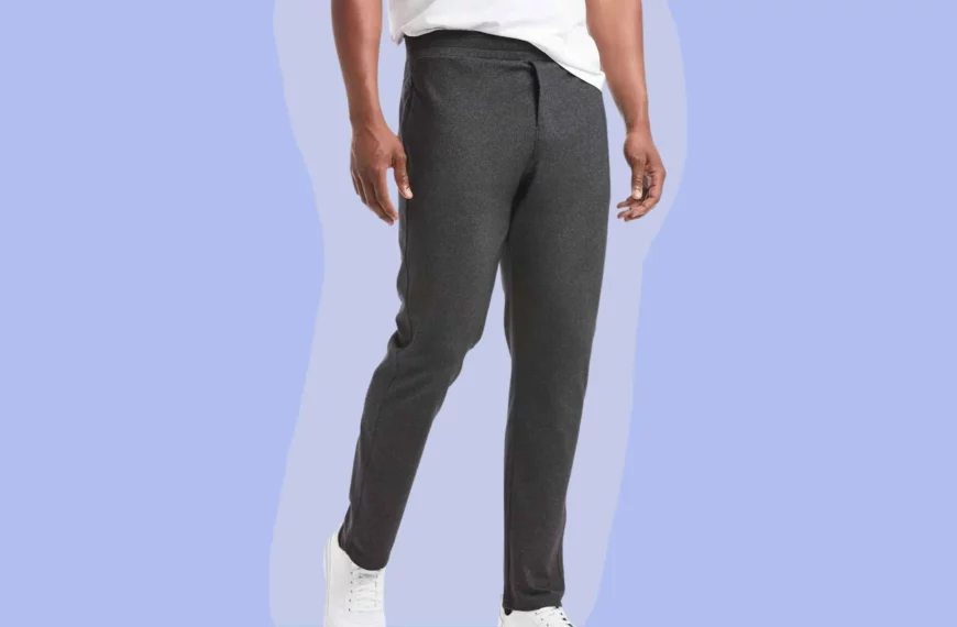 man wearing public rec pants in dark gray with white shoes