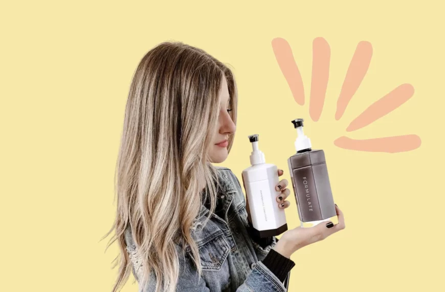 woman with long blonde hair looking at a bottle of formulate shampoo and conditioner