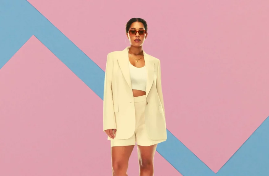 woman wearing sunglasses, wearing 2 piece cream-colored jacket and shorts from Aritzia