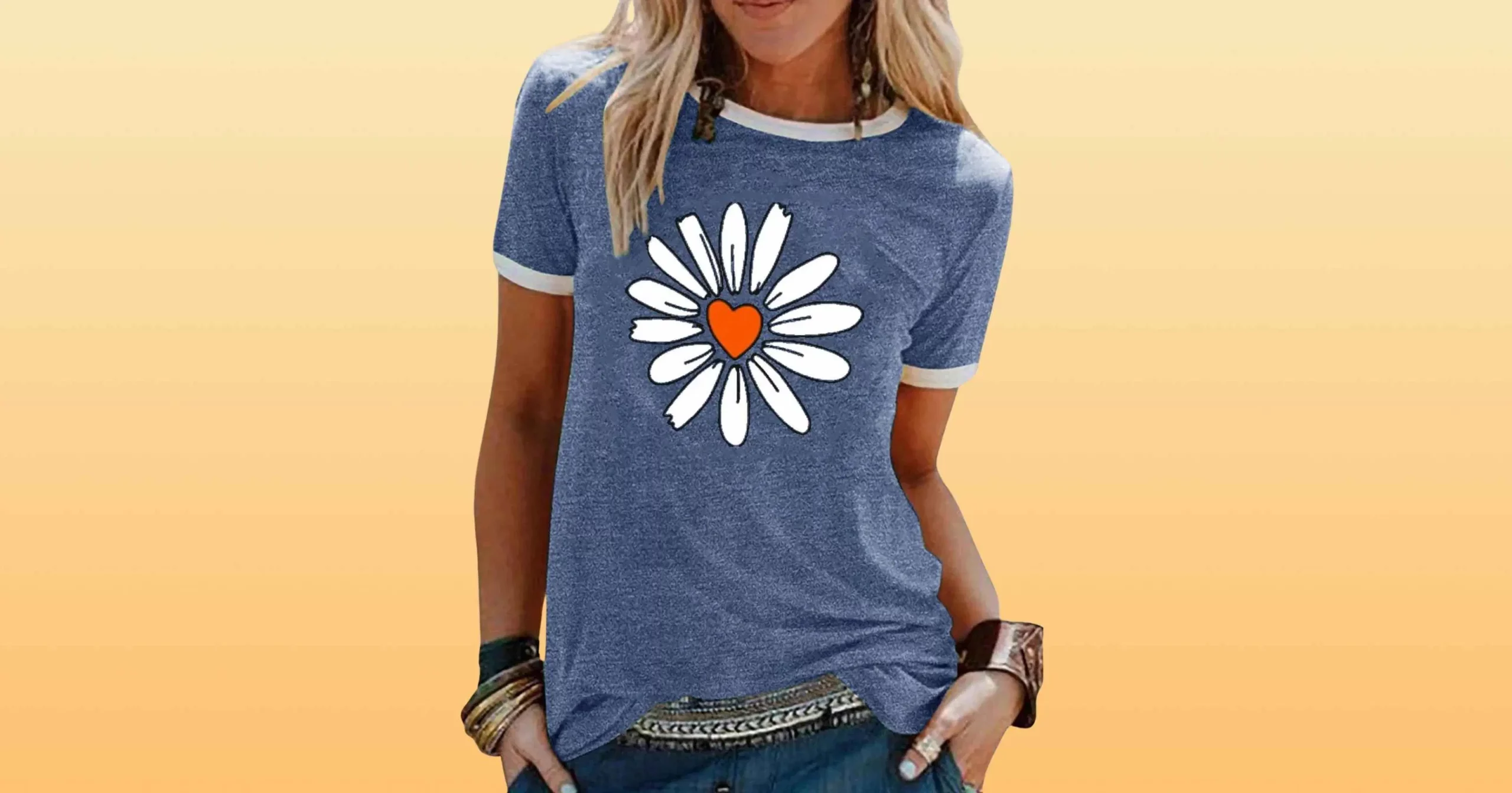 body shot of woman wearing blue shirt with sunflower and heart graphic by Lilicloth