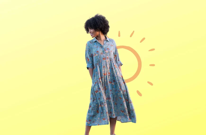 woman looking over shoulder wearing blue floral dress from Natural Life Clothing