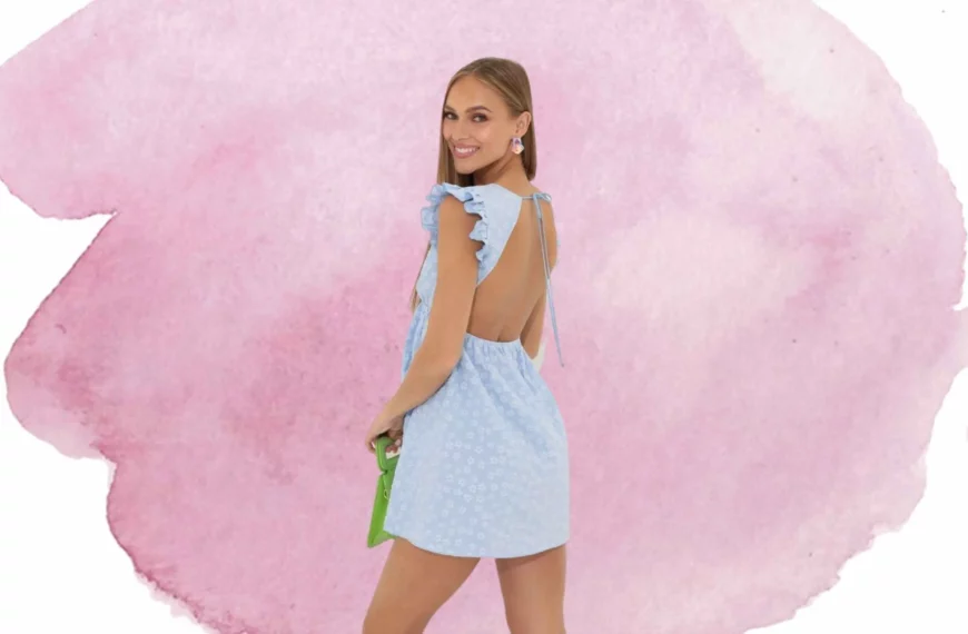 woman looking over shoulder, wearing blue floral dress from Lucy In The Sky