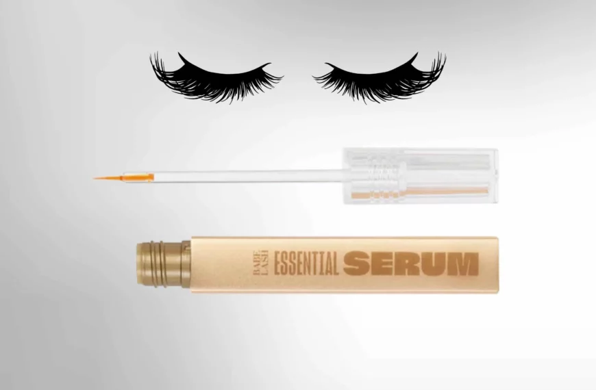 set of eyelashes on top, underneath is a gold bottle of Babe Lash Essential Serum