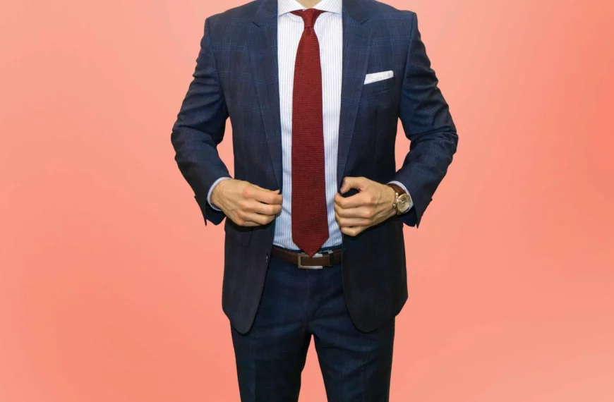 modern fit vs slim fit: man wearing dark blue plaid suit and red tie