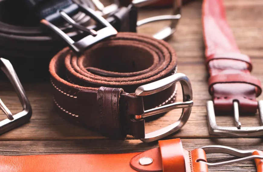 brown and black belts on wooden table