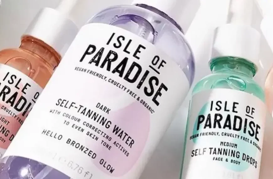 closeup of Isle of Paradise self-tanners in orange, purple, green, and pink