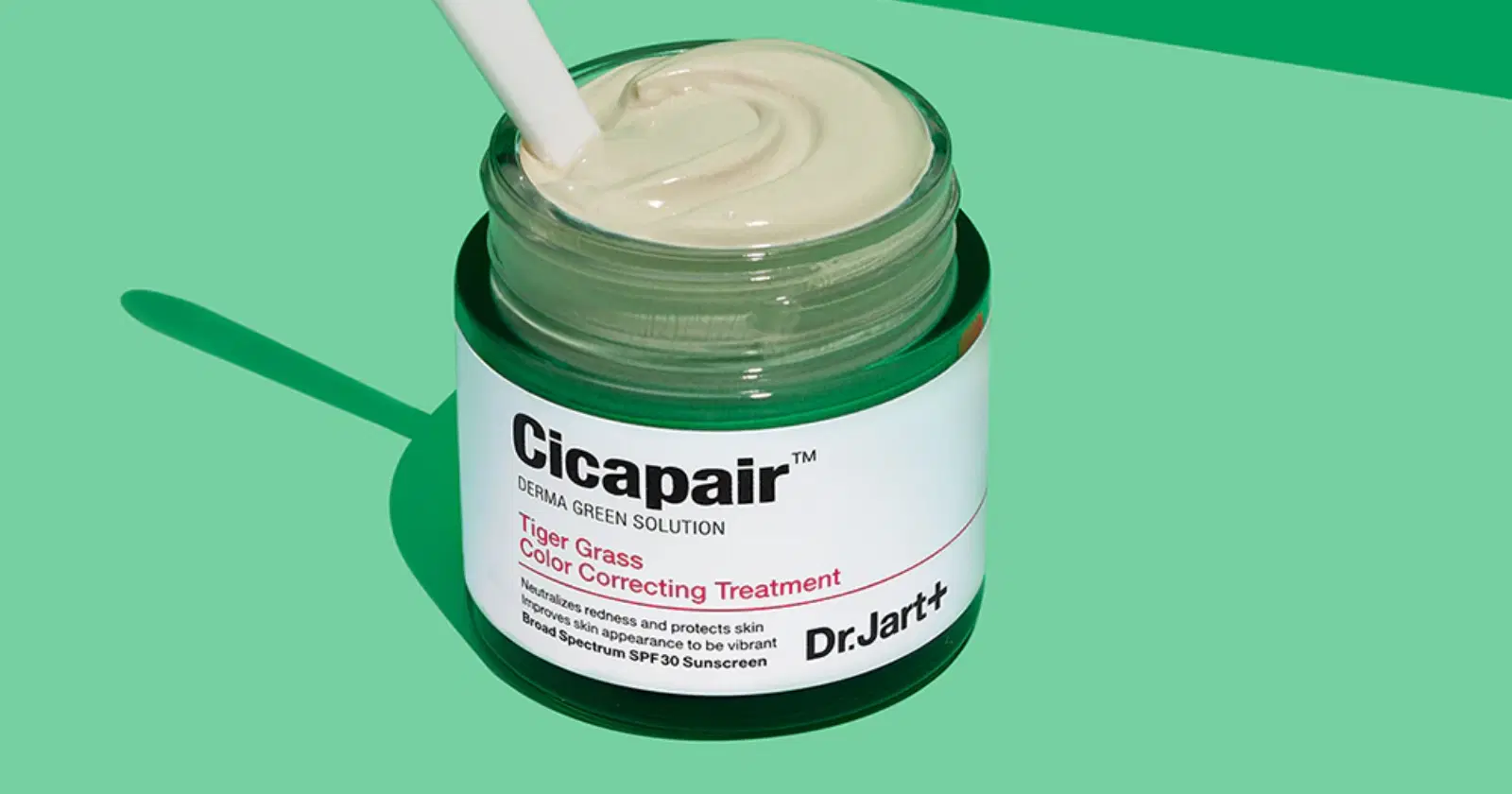 jar of Dr Jart color correcting treatment against green background