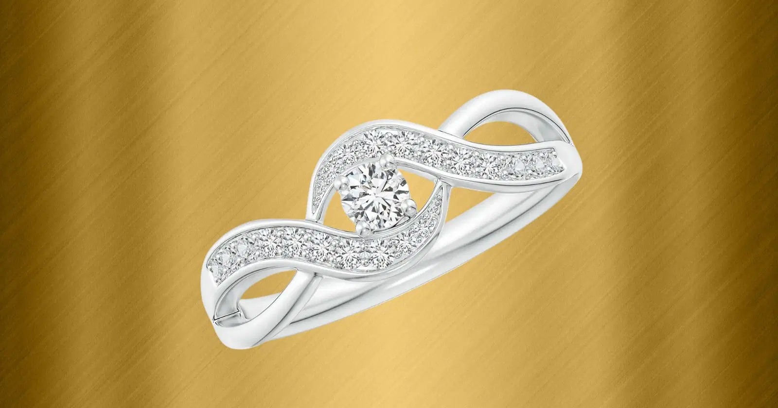 Angara diamond engagement ring against gold background