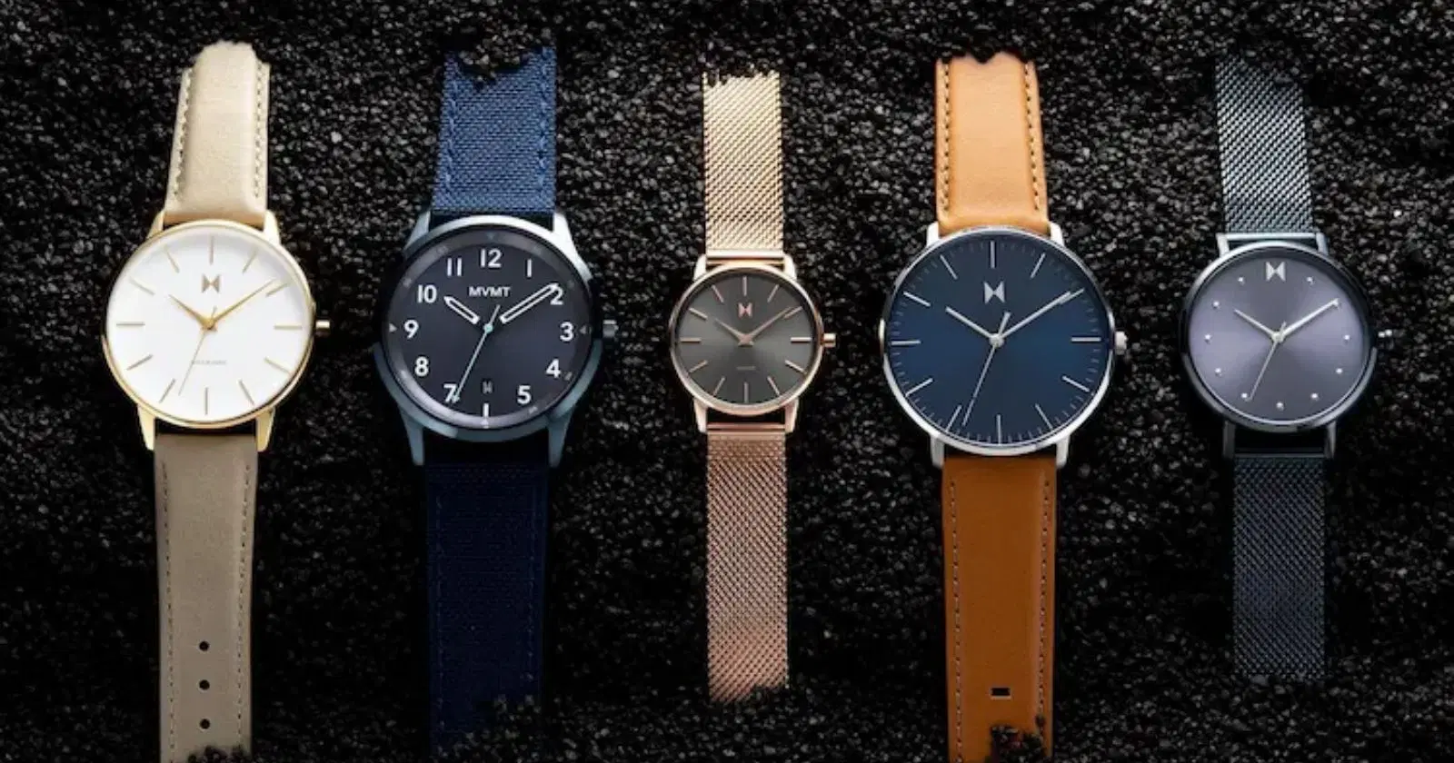 variety of 5 MVMT watches in black sand