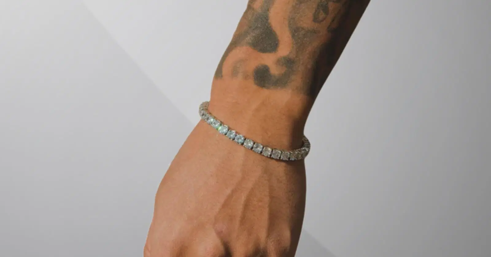 close up of person's wrist with tattoos, wearing tennis bracelet from Cernucci