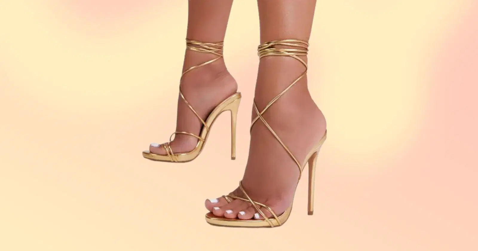 close up of person's feet wearing gold strappy heels from Ego Shoes